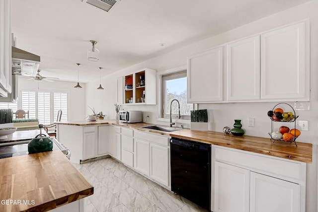 4731 Leeds Ave, El Paso, TX 79903 - kitchen with marble finish floor, butcher block counters, a sink, and dishwasher