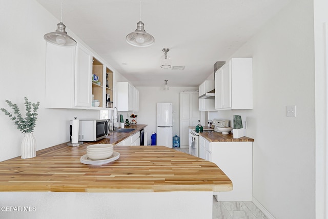 4731 Leeds Ave, El Paso, TX 79903 - kitchen with a peninsula, a sink, open shelves, white cabinets, and white appliances
