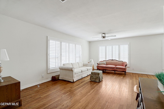4731 Leeds Ave, El Paso, TX 79903 - living area with light wood finished floors, baseboards, and ceiling fan