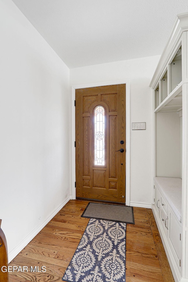 4731 Leeds Ave, El Paso, TX 79903 - foyer entrance with light wood-style flooring and baseboards