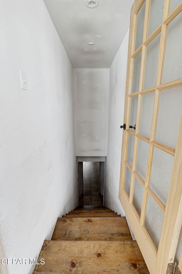 4731 Leeds Ave, El Paso, TX 79903 - staircase with wood finished floors and a fireplace