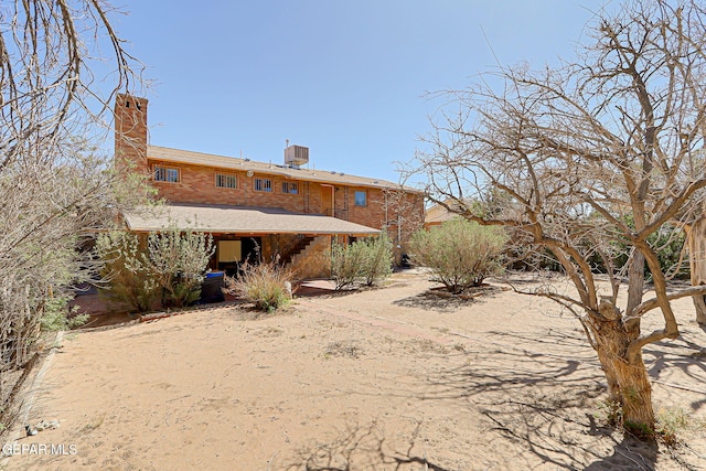 4731 Leeds Ave, El Paso, TX 79903 - back of house with a chimney