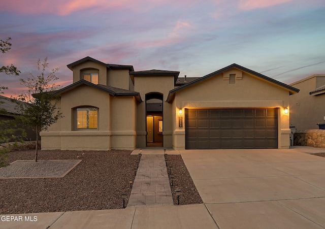 7809 Enchanted Circle Dr, El Paso, TX 79911 - mediterranean / spanish-style home featuring stucco siding, a garage, and concrete driveway