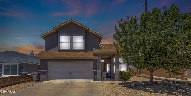 841 Dakota River Ave, El Paso, TX 79932 - traditional-style home with a garage, stucco siding, driveway, and a shingled roof