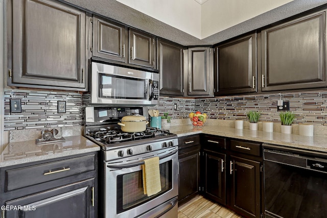 2250 Nancy Mcdonald Dr, El Paso, TX 79936 - kitchen featuring stainless steel appliances, light stone counters, and backsplash