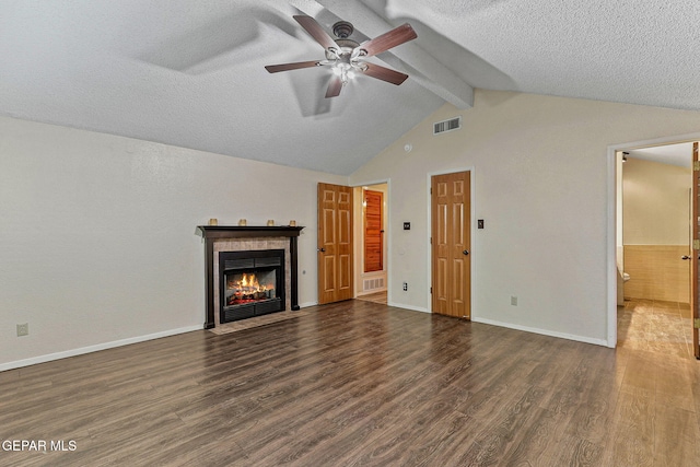 2250 Nancy Mcdonald Dr, El Paso, TX 79936 - unfurnished living room featuring wood finished floors, a ceiling fan, a textured ceiling, a fireplace, and baseboards
