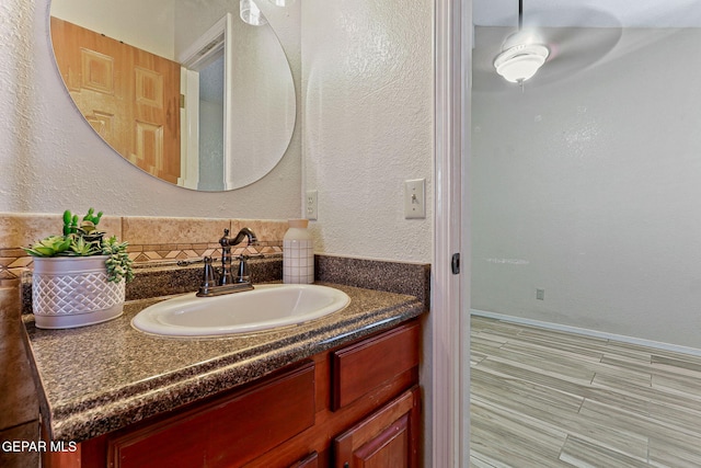 2250 Nancy Mcdonald Dr, El Paso, TX 79936 - bathroom with vanity and tasteful backsplash