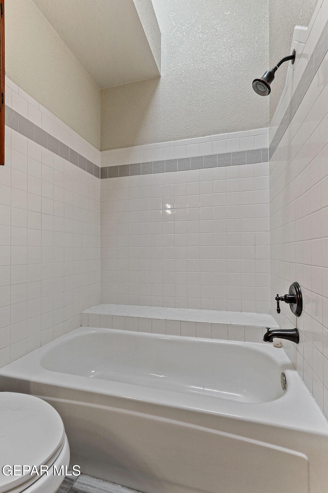 2250 Nancy Mcdonald Dr, El Paso, TX 79936 - bathroom with a tub to relax in and toilet