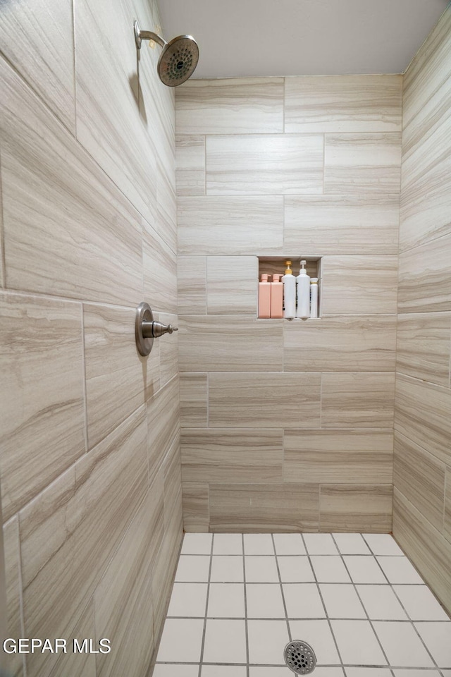 bathroom with a tile shower