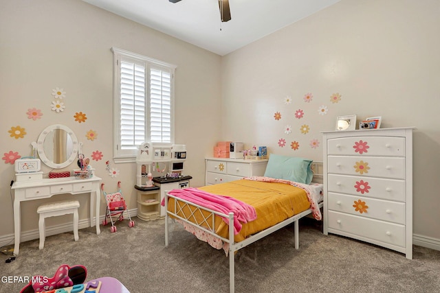 carpeted bedroom with baseboards and ceiling fan