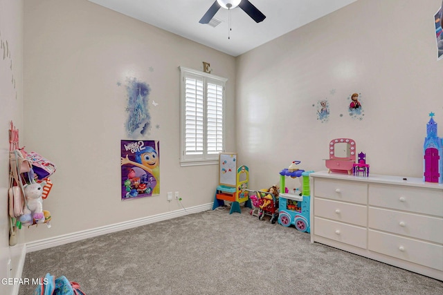 recreation room featuring a ceiling fan, carpet, and baseboards