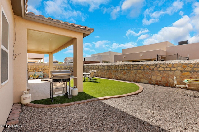 fenced backyard featuring a patio area
