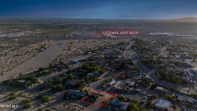 aerial view of property's location with property parcel outlined and a mountainous background