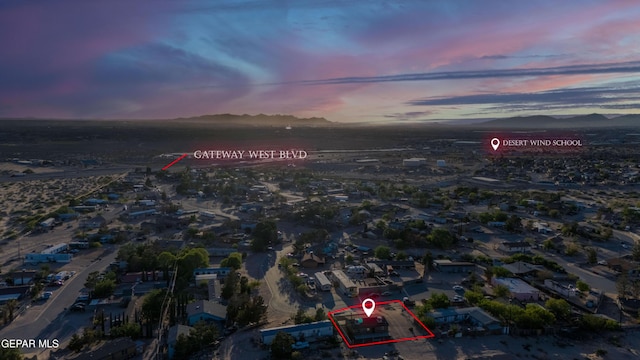 aerial view at dusk of a mountain view and property parcel outlined