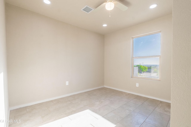 empty room with recessed lighting, a ceiling fan, and baseboards