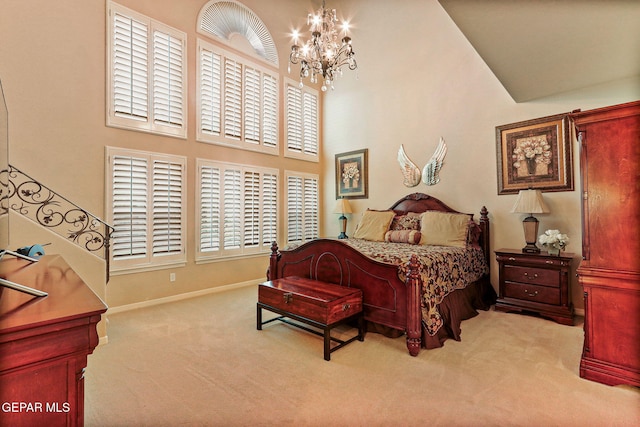 6225 Via Serena Dr, El Paso, TX 79912 - bedroom featuring carpet flooring, a chandelier, a towering ceiling, and baseboards