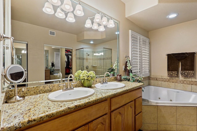 6225 Via Serena Dr, El Paso, TX 79912 - full bath featuring a shower stall, a tub with jets, double vanity, and a spacious closet