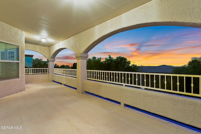6225 Via Serena Dr, El Paso, TX 79912 - patio terrace at dusk featuring a balcony