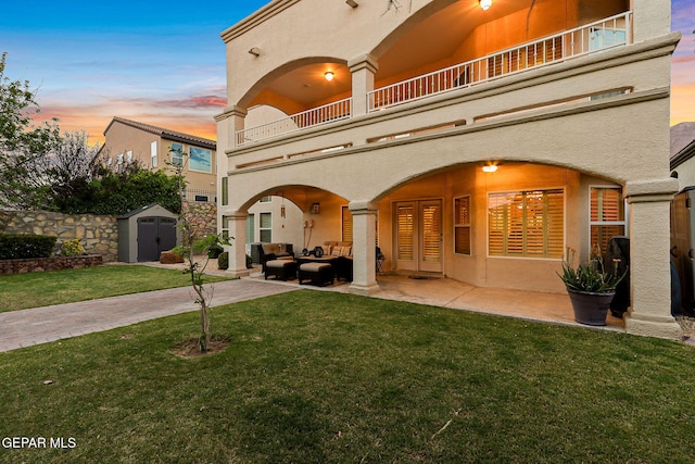 6225 Via Serena Dr, El Paso, TX 79912 - exterior space featuring a balcony, an outdoor hangout area, a storage shed, and a patio