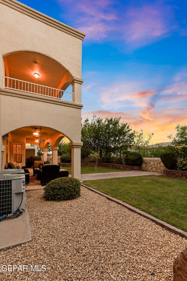 6225 Via Serena Dr, El Paso, TX 79912 - view of grassy yard with a balcony, cooling unit, a patio area, and an outdoor living space