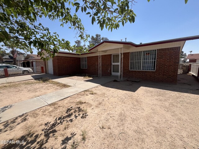 8734 Plains Dr, El Paso, TX 79907 - ranch-style home featuring brick siding and fence