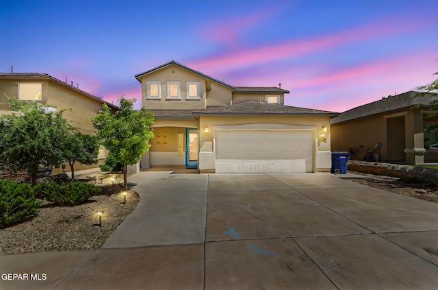 7541 Wolf Creek Dr, El Paso, TX 79911 - traditional home featuring stucco siding, driveway, and a garage