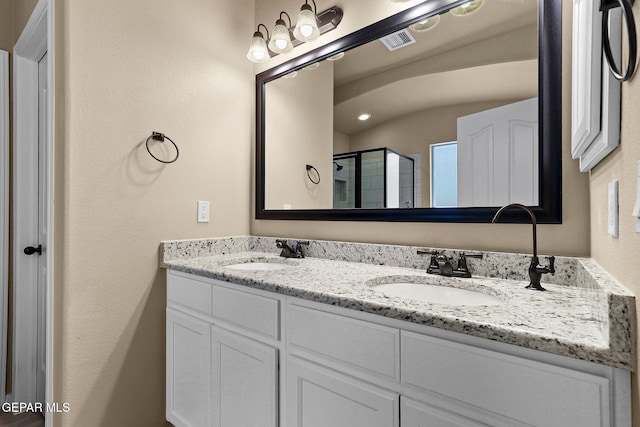 7541 Wolf Creek Dr, El Paso, TX 79911 - full bath featuring a shower stall and double vanity