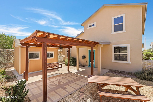 7541 Wolf Creek Dr, El Paso, TX 79911 - rear view of house with a ceiling fan, a pergola, a patio area, and stucco siding