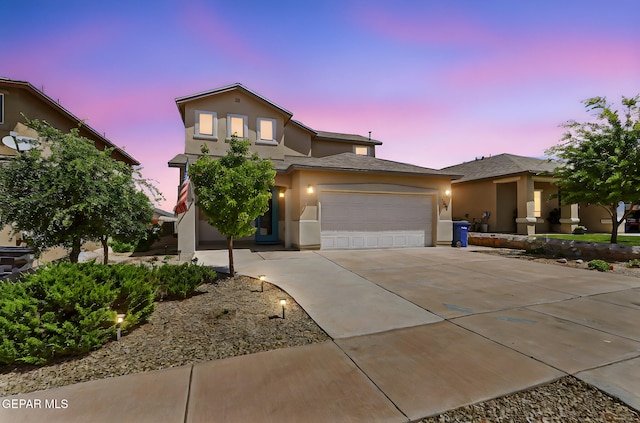 7541 Wolf Creek Dr, El Paso, TX 79911 - view of front of property featuring stucco siding, an attached garage, and concrete driveway