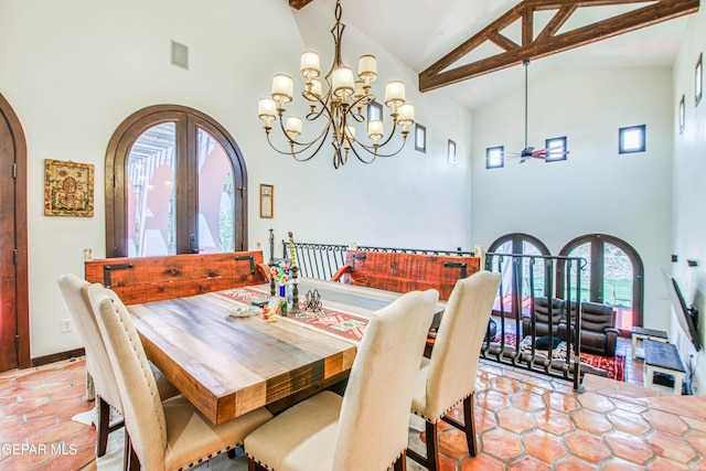 dining room with high vaulted ceiling, arched walkways, french doors, a chandelier, and beam ceiling