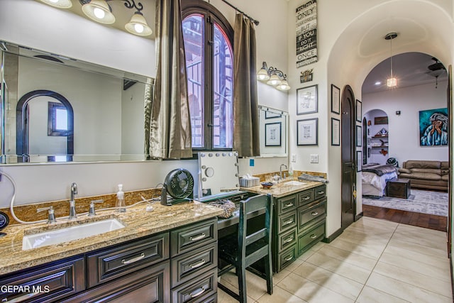 full bathroom featuring tile patterned flooring, vanity, and ensuite bath