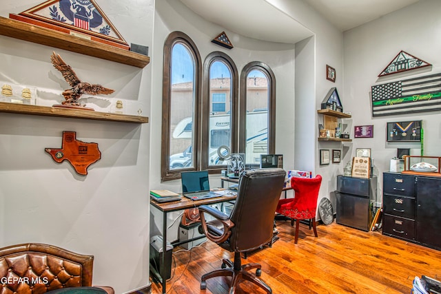 office with hardwood / wood-style flooring