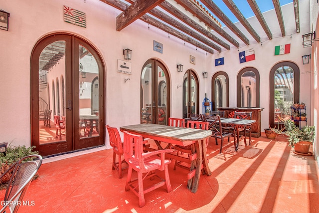 view of patio featuring french doors and outdoor dining area