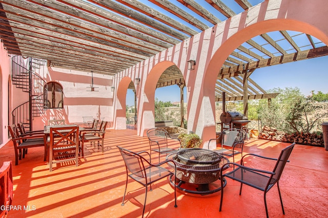 view of patio with a pergola, stairs, and outdoor dining area