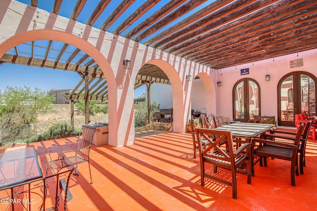 view of patio / terrace featuring a pergola, outdoor dining area, and french doors