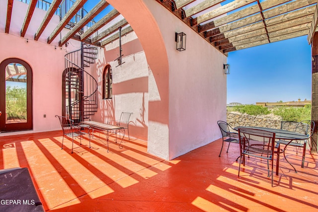 view of patio / terrace featuring outdoor dining space and a pergola