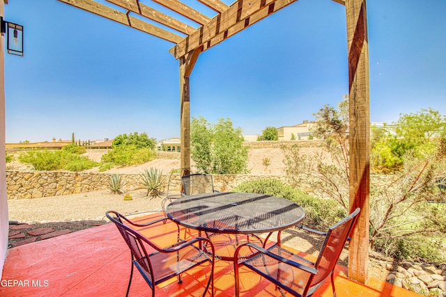 view of patio featuring outdoor dining space, a pergola, and fence