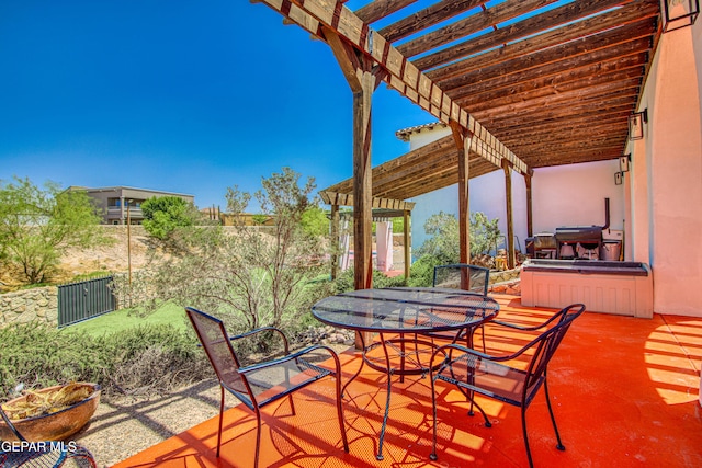 view of patio featuring a pergola, outdoor dining space, and fence