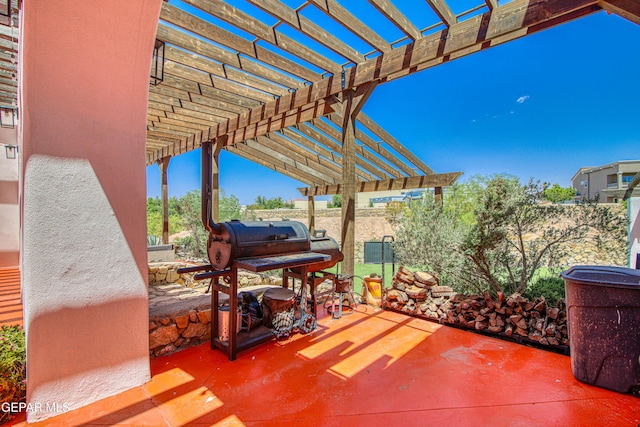view of patio with a pergola and fence