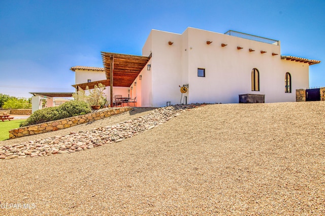view of property exterior with stucco siding