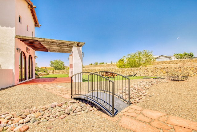 view of yard featuring a pergola, a patio, and fence