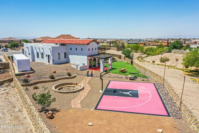 view of sport court featuring basketball hoop