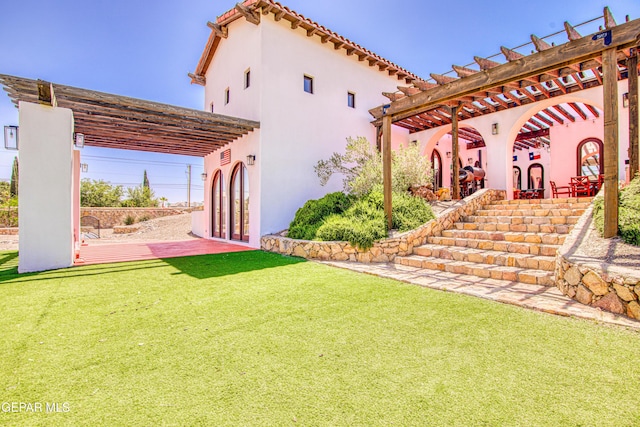 view of green lawn with a pergola