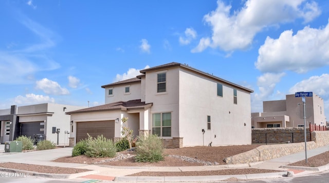13868 Sky Ranger Ave, El Paso, TX 79928 - view of front of property with concrete driveway, fence, stucco siding, and a garage