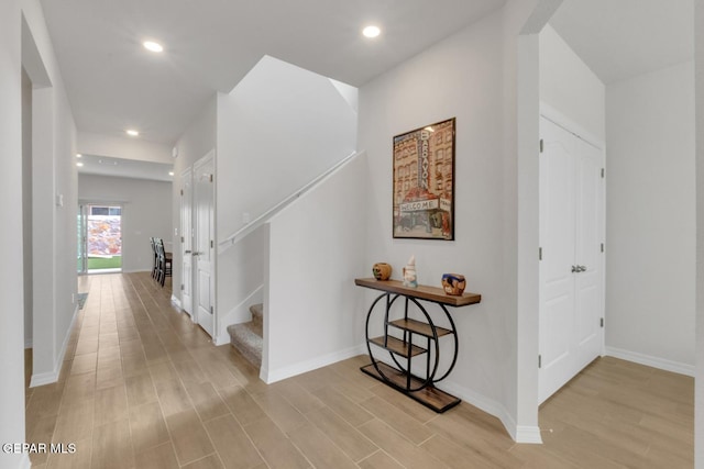 13868 Sky Ranger Ave, El Paso, TX 79928 - hallway with light wood-style flooring, baseboards, stairs, and recessed lighting