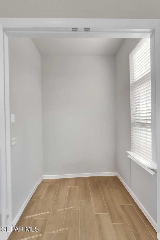 13868 Sky Ranger Ave, El Paso, TX 79928 - spare room with wood tiled floors and baseboards