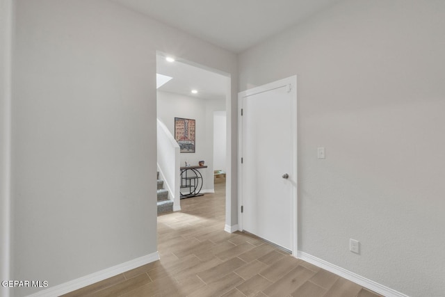 13868 Sky Ranger Ave, El Paso, TX 79928 - corridor featuring stairway, light wood-type flooring, and baseboards