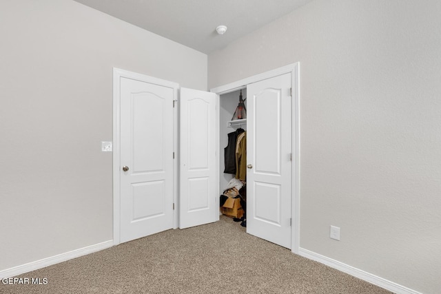 13868 Sky Ranger Ave, El Paso, TX 79928 - unfurnished bedroom with light colored carpet, baseboards, and a closet