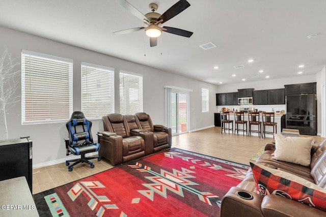13868 Sky Ranger Ave, El Paso, TX 79928 - living room featuring a ceiling fan, light wood-style floors, recessed lighting, and baseboards