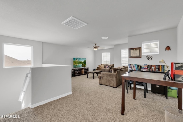 13868 Sky Ranger Ave, El Paso, TX 79928 - living area featuring light carpet, plenty of natural light, a ceiling fan, and an office area